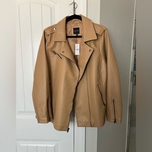 Faux leather jacket. Camel colored new with tags never worn.